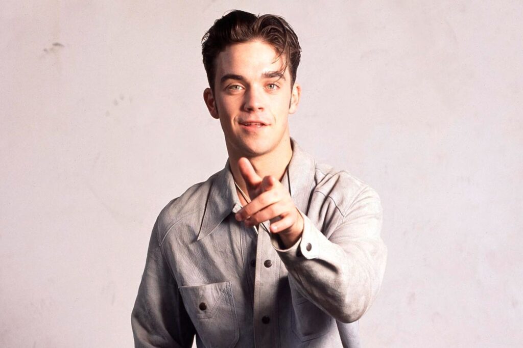 Robbie Williams Didn’t Realize He Was a Take That ‘Backing Dancer’ Until a Few Years in