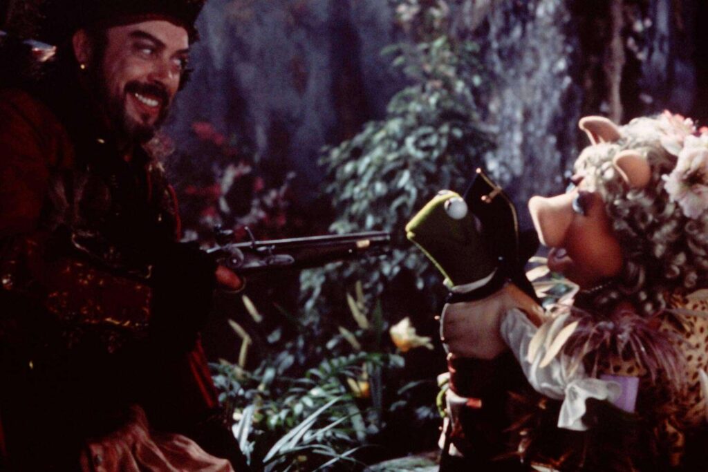 Tim Curry Ad-Libbed a Risqué Line About ‘Seductive Girl’ Miss Piggy That Got Cut from ‘Muppet Treasure Island’
